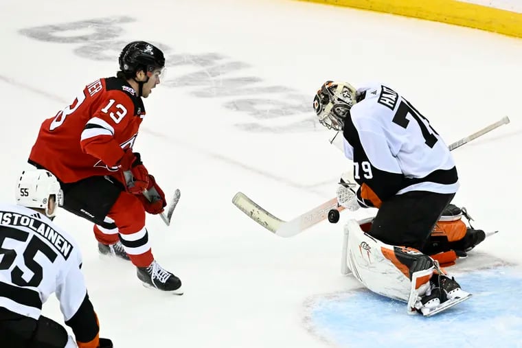 Flyers goaltender Carter Hart (79) makes a stop on a shot by New Jersey Devils center Nico Hischier in the third period. Hart finished with 48 saves in the Flyers win.