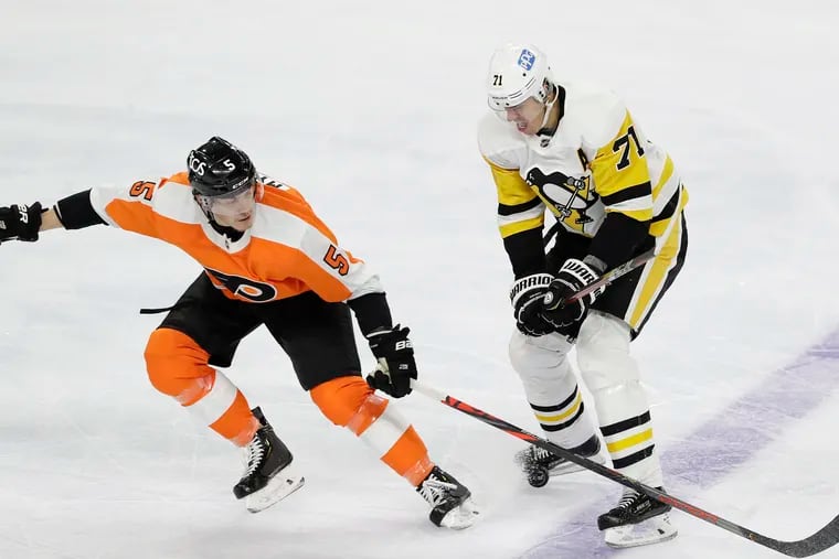 Flyers defenseman Phil Myers, shown defending Pittsburgh Penguins center Evgeni Malkin (right) on Jan. 13, was injured Tuesday against Buffalo.