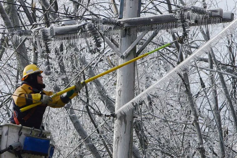 JC Zwick works on damages power lines yesterday in Jaffrey, N.H. Hundreds of thousands in the Northeast were still without power after last week&#0039;s ice storm.