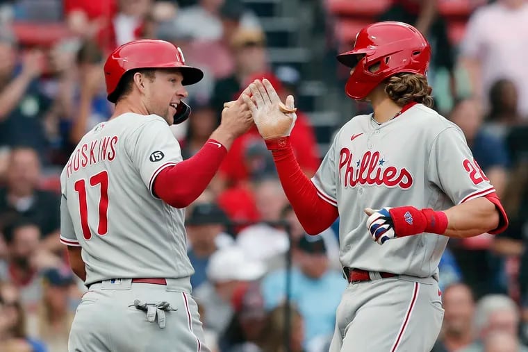 The Phillies' Alec Bohm celebrates his two-run home run that also drove in Rhys Hoskins  during the second inning in Boston.