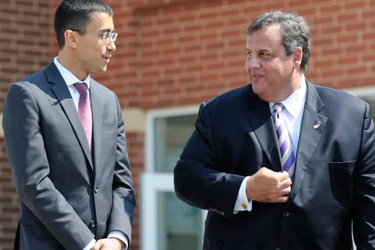 New Camden school superintendent Paymon Rouhanifard and New Jersey Governor Chris Christie chat before his announcement as superintendent at H.B. Wilson Elementary School in Camden. August 21, 2013 ( RON TARVER / Staff Photographer )