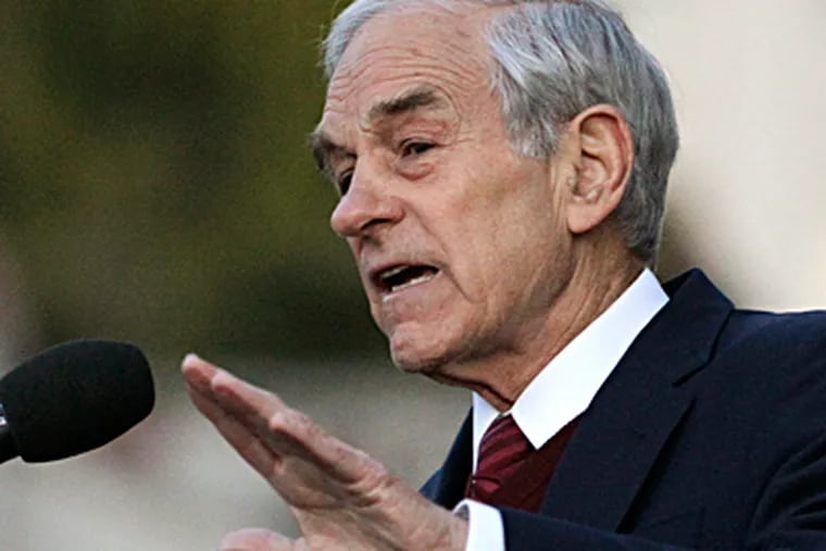 Ron Paul was among the leading vote-getters when online balloting was halted Tuesday. BEN MARGOT / AP