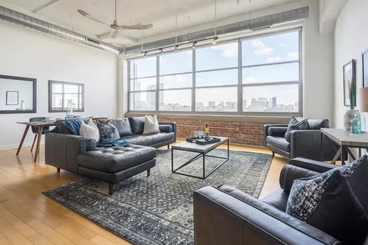 A one-bedroom loft at 2200 Arch St. has an open floor plan and a bank of windows with a western view.
