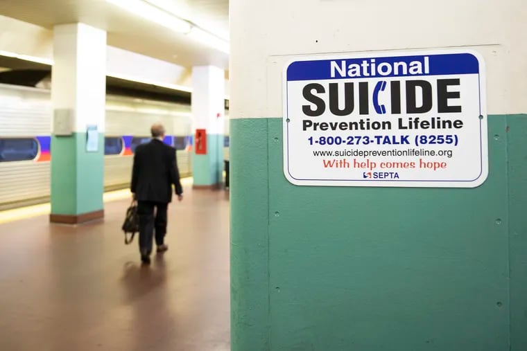 A sign for suicide prevention, photographed on the train platform at Suburban Station in Center City.