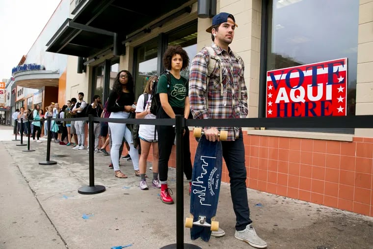 In this Tuesday, Nov. 8, 2016 file photo, voters wait in line to cast their ballots at the polling location in the University Co-op next to the University of Texas at Austin campus in Austin. On Friday, Feb. 1, 2018, The Associated Press has found that stories circulating on the internet that 58,000 non-citizens voted in Texas, are untrue. (Jay Janner/Austin American-Statesman via AP)
