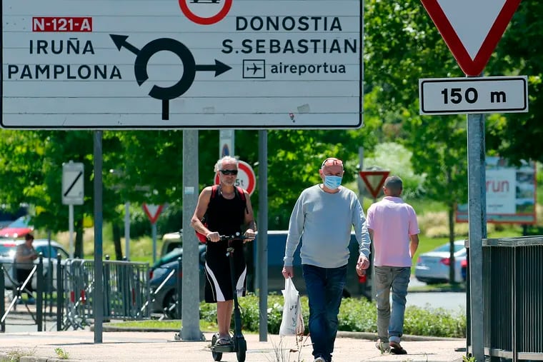People crossing the border between France and Spain at Behobie, southwestern France on Sunday. Spain reopened its borders to European tourists Sunday in a bid to kickstart its economy.