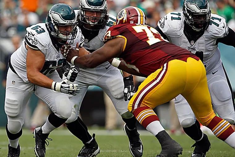 Eagles offensive linemen David Molk, Dennis Kelly and Jason Peters. (Yong Kim/Staff Photographer)
