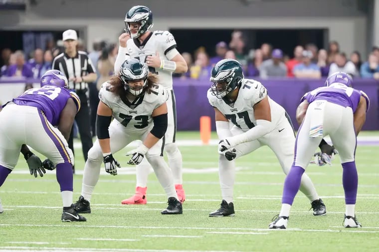 Eagles offensive linemen Isaac Seumalo (left) and Andre Dillard on the line against the Vikings on Sunday.