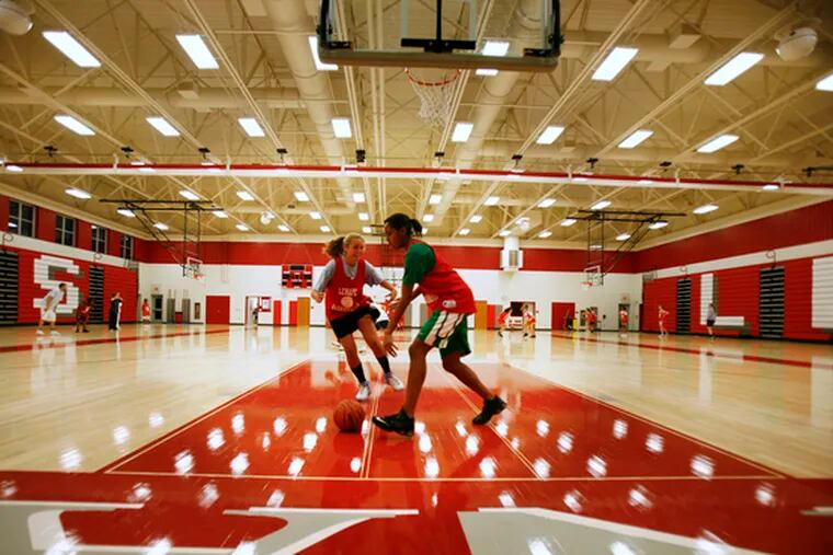 Lenape&#0039;s Moira Anthony guards teammate Advia Campbell during a practice in the school&#0039;s gym.