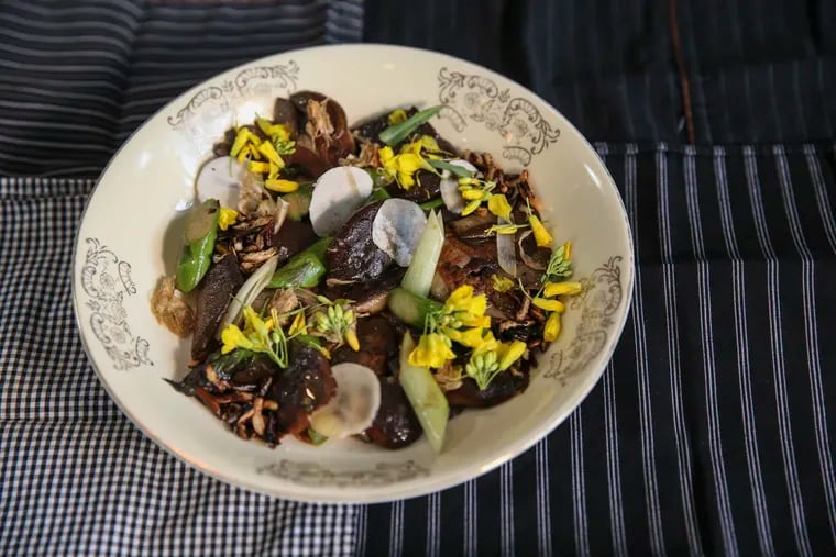 Shiitake caps and oyster mushrooms are roasted to a heightened umami over the plancha before they’re tumbled with puffed wild rice, fiddlehead ferns, and flowering yellow kale raab.