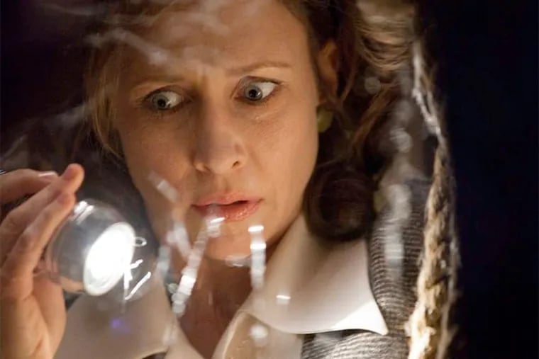 Vera Farmiga plays Lorraine Warren , a demonologist investigating paranormal activity in a Rhode Island house. MICHAEL TACKETT