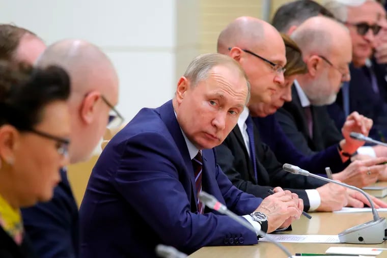 Russian President Vladimir Putin attends a meeting on drafting constitutional changes at the Novo-Ogaryovo residence outside Moscow on Thursday. At the meeting, Putin proposed a set of constitutional amendments that could keep him in power well past the end of his term in 2024.