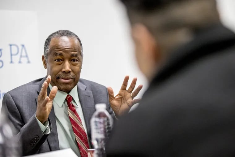 HUD Secretary Ben Carson, left, speaks to Norma Cuevas, right, a Pathways to Housing participant who found housing through the organization, during a roundtable discussion on March 29, 2018 at the organizations offices.