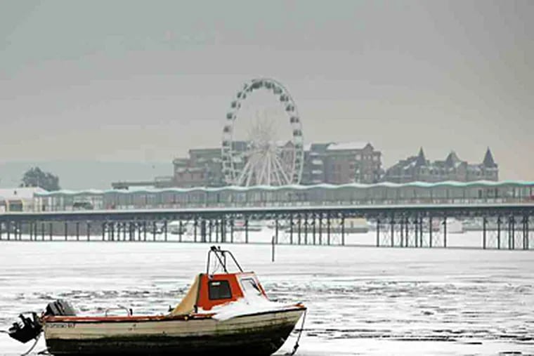 Freshly fallen snow covers the beach in Weston-Super-Mare, England after this week's heavy storms.