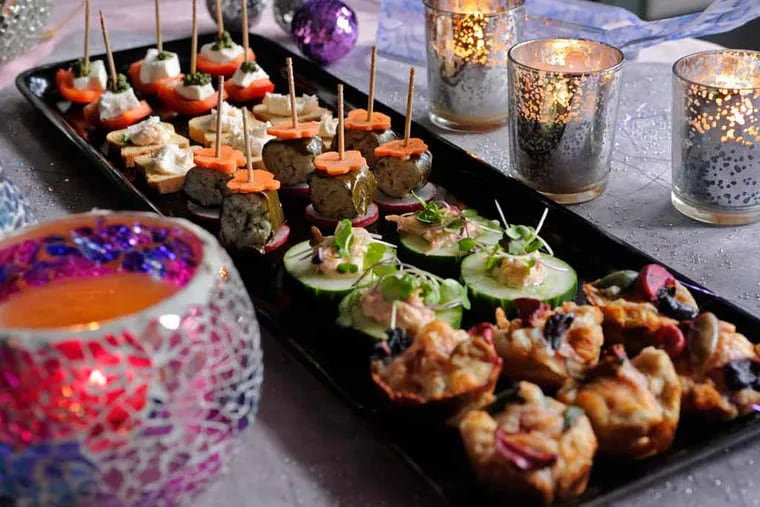 Assorted canapes by Anna Herman, as she writes about her family's traditional party on New Year's Eve, started by her parents who eloped on December 31.  ( TOM GRALISH / Staff Photographer )
