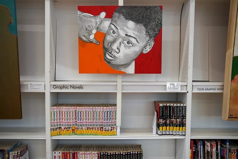 A painting by artist Ann Hartzell of Markeish Johnson, who was shot and killed in 2016, at the Logan Library in North Philadelphia