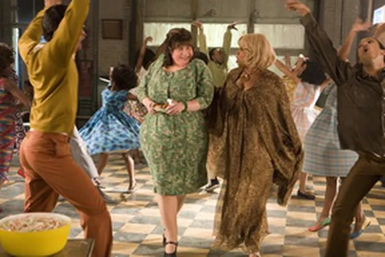 Cross-dressing John Travolta stars as the shy mother , Edna Turnblad, and Queen Latifah is the DJ Motormouth Maybelle. Travolta may be miscast, but that&#0039;s about the only misstep in this musical descendant of John Waters&#0039; 1988 original.