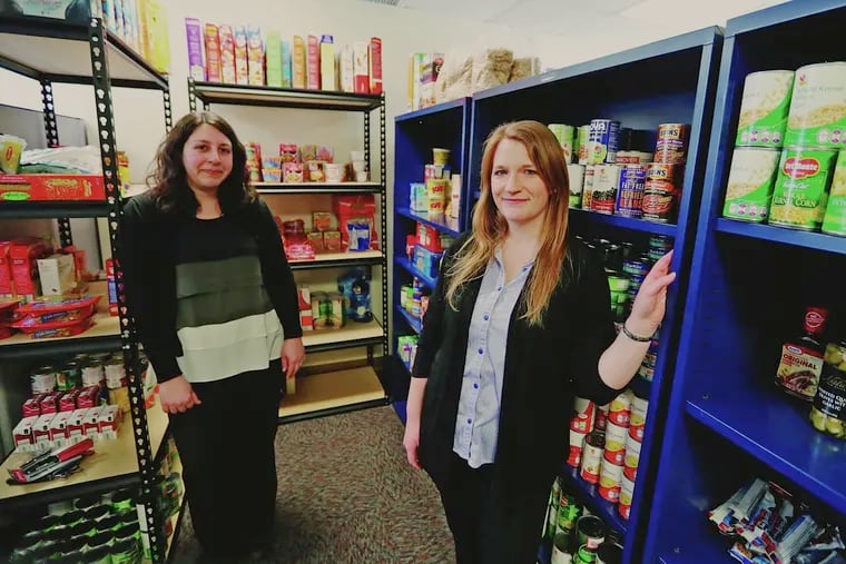 Jodi Roth-Saks (left) and Tori Nuccio in the new food pantry at West Chester University.