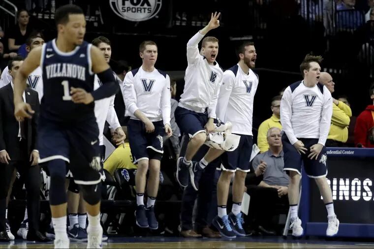 Villanova players react after a basket against Seton Hall during the second half .