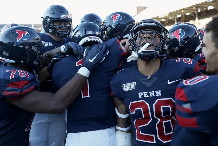Penn defensive back Tayte Doddy (28) and his teammates celebrate after time expired in a game against Brown at Franklin Field in Philadelphia on Saturday, Nov. 2, 2019. Penn won 38-36.