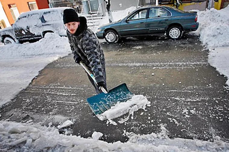 Tony Rodriquez of N. 6th St. near Clearfield took clearing the street to a new level during last week's snow storms. He is clearing the street and his car parked in front of his house. (Alejandro A. Alvarez / Staff)