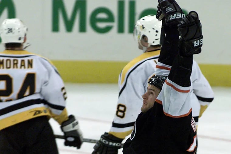 Keith Primeau raises his arms after scoring the game-winning goal in the fifth overtime against the Pittsburgh Penguins on May 4, 2000. It was the longest game in modern NHL history at 152:01.