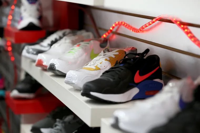 Nike sneakers sit on a shelf inside Young's Sneaker City in Brewerytown.