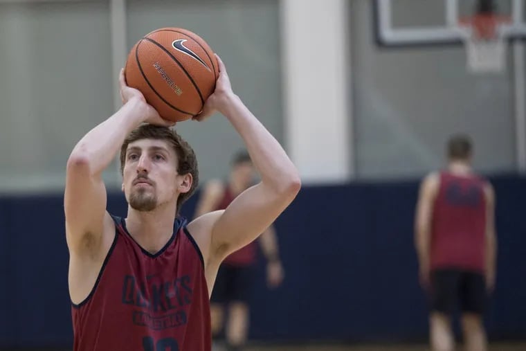 Penn’s Caleb Wood shooting free throws during practice at Hutchinson Gym on Monday.