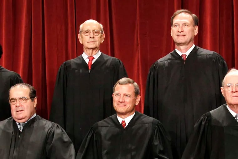 The official U.S. Supreme Court photo in 2010, with Justice Antonin Scalia at left.