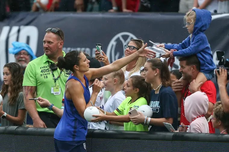 Carli Lloyd signed a few autographs after the U.S. women's soccer team's public training session at Lincoln Financial Field.