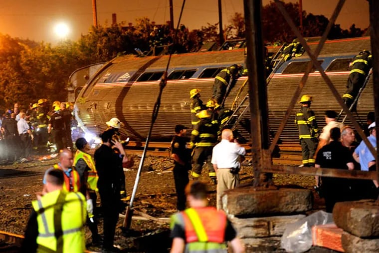 After Train 188 derailed, rescue operations had to focus not only on saving survivors and searching for victims, but on comprehending the steps families would take to find loved ones, and managing the needs of first responders. (TOM GRALISH / Staff Photographer)