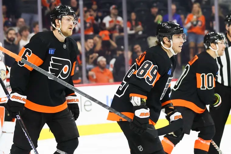 Flyers defenseman Travis Sanheim (left) discussed potential mandatory neck protection in the NHL following Adam Johnson's death during a game in England.