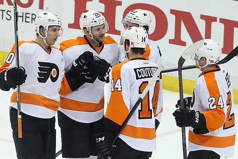 Philadelphia Flyers center Brayden Schenn (L) celebrates his goal with teammates against the Pittsburgh Penguins during the second period at the CONSOL Energy Center. The Flyers won 4-1. (Charles LeClaire/USA Today)