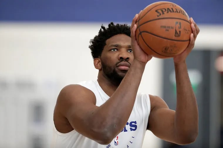 Sixers’ Joel Embiid takes a shot at the Sixers practice facility on Friday.
