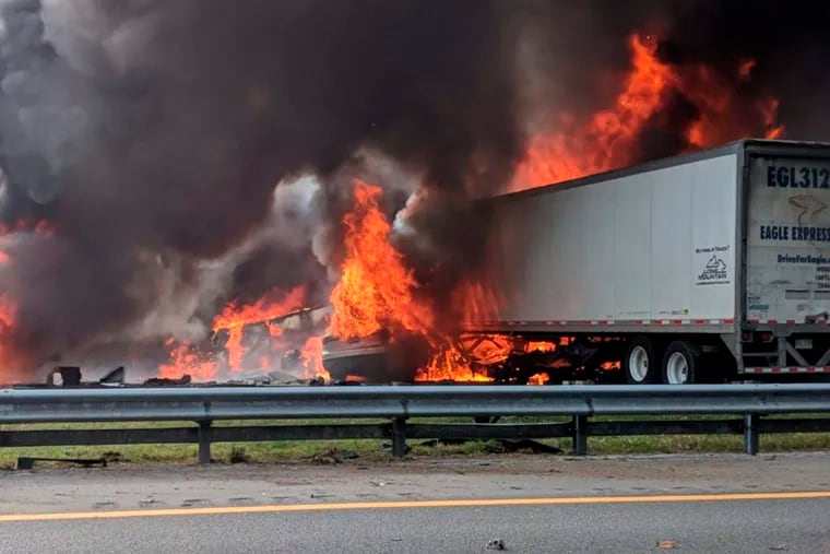 Flames engulf vehicles after a fiery crash along Interstate 75, Thursday, Jan. 3, 2019, about a mile south of Alachua, near Gainesville, Fla. Highway officials say at least six people have died after a crash and diesel fuel spill sparked a massive fire along the Florida interstate. (WGFL-Gainesville via AP)