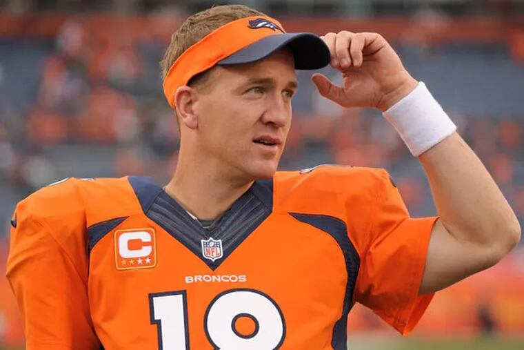 Broncos quarterback Peyton Manning (18) watches play from the sidelines late in the fourth quarter against the Philadelphia Eagles in an NFL football game, Sunday, Sept. 29, 2013, in Denver. Denver won 52-20. (Jack Dempsey/AP)