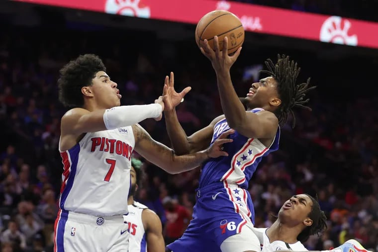 Tyrese Maxey, wearing a New Balance shoe, drives to the basket against the Pistons' Killian Hayes on Tuesday.
