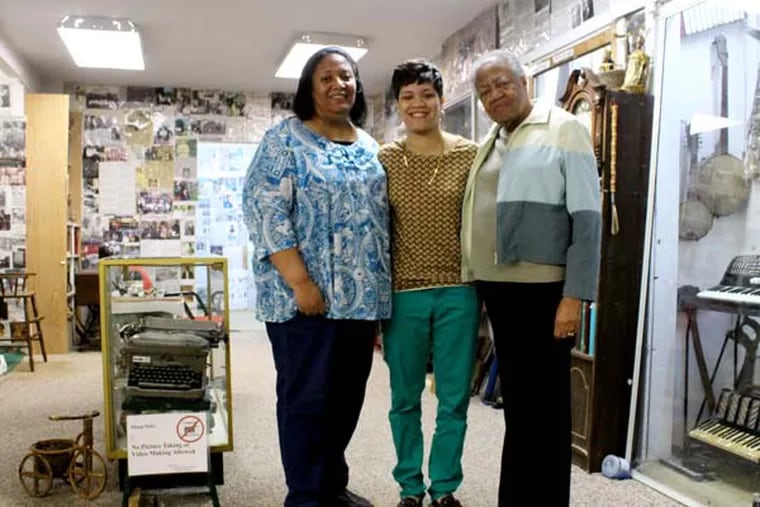 Bethany Benson King (left), her daughter Shelby King (middle) and her mother Ellen Benson (right), in the museum that her father Rev. James Benson created in Lawnside, New Jersey on Thursday, April 10, 2014. ( COURTNEY MARABELLA / Staff Photographer )