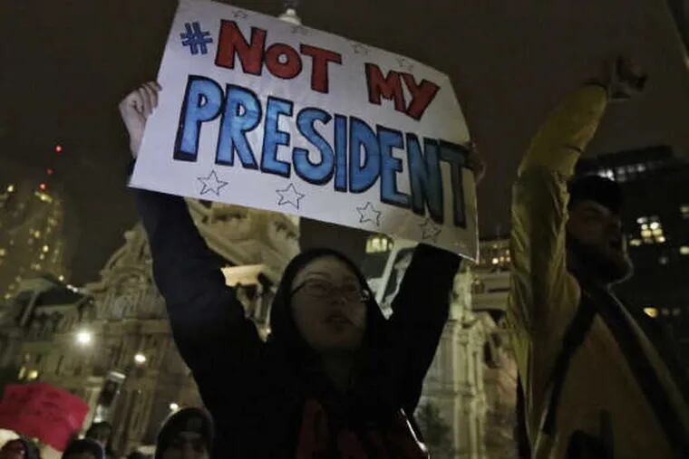 Maddy Ballard of Philadelphia participates in the protest of the election of Donald Trump at City Hall&#039;s Thomas Paine Plaza on Nov. 9, 2016.