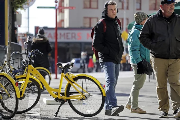 An ofo bike is pictured in Seattle in February. The Chinese-based company will join up with Coopers Ferry Partnership to bring dockless bike sharing to Camden in May.