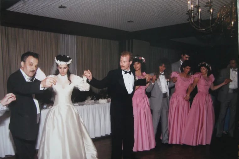 This June 1989 photo at the former St. Davids Inn in Radnor, Pa., shows Inquirer columnist Maria Panaritis Greek dancing at the wedding of her sister, Helen. Their dad, post-World-War-II immigrant Christos Panaritis, is leading the group.