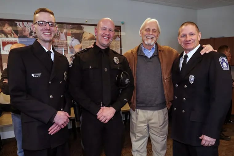When Glenn McClintock's heart stopped, he was rescued by (from left) Mike Edwards, Nathan Miller and Raymond Stackhouse, who used CPR and shocks from an external automated defibrillator.