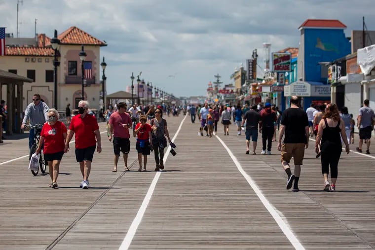 People fill the boardwalk in Ocean City, N.J., while enjoying the weather and the beach on Saturday, May 16, 2020. Ocean City is one of few beaches doing a “dry run” to test “capacity management” this weekend in preparation for Memorial Day.