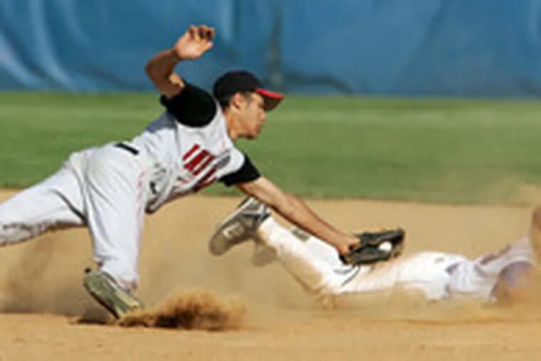 Washington Twp.&#0039;s Chris Fanty dives safely back to second as Lenape&#0039;s Justin Carter tries for the tag.