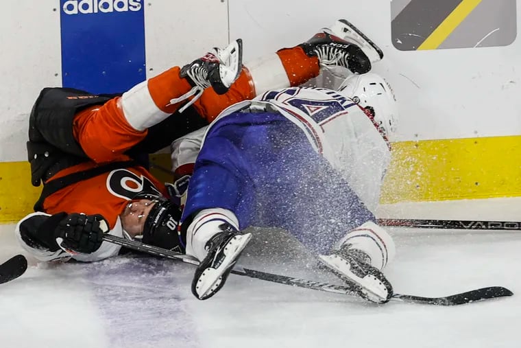 Flyers Bobby Brink collides with Canadiens Nick Suzuki during the second period at the Wells Fargo Center in Philadelphia, Wednesday, January 10, 2024.