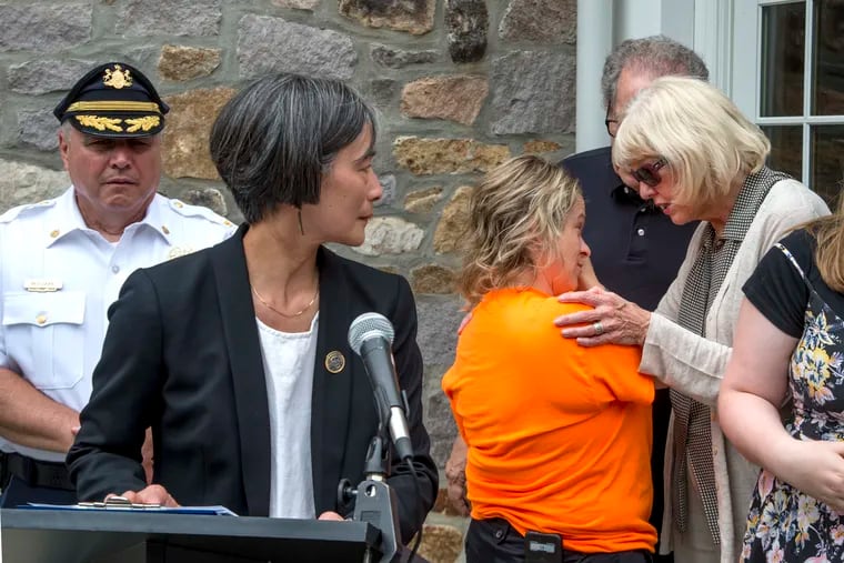 Sharon Patrick (right) and her husband Rich, grandparents and legal guardians of Jimi Patrick, one of Cosmo DiNardo's four victims, greets Melissan Fratanduono-Meo, mother of another DiNardo victim Tom Meo, prior to PA State Rep. Helen Tai (D – Bucks) starting a press conference at the Solebury Township Building July 31, 2018 where she announced she will be introducing three gun safety bills into the legislature this fall. At left is Solebury Township police chief Dominick Bellizzie.