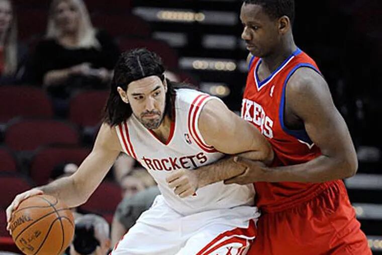 Luis Scola scored 19 points and grabbed 10 rebounds for the Rockets in their win over the Sixers. (Pat Sullivan/AP)