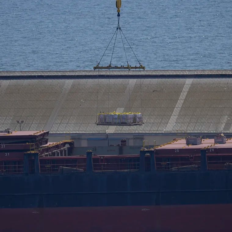 A crane loads food aid for Gaza onto the container ship Sagamore docked at Larnaca port, Cyprus.