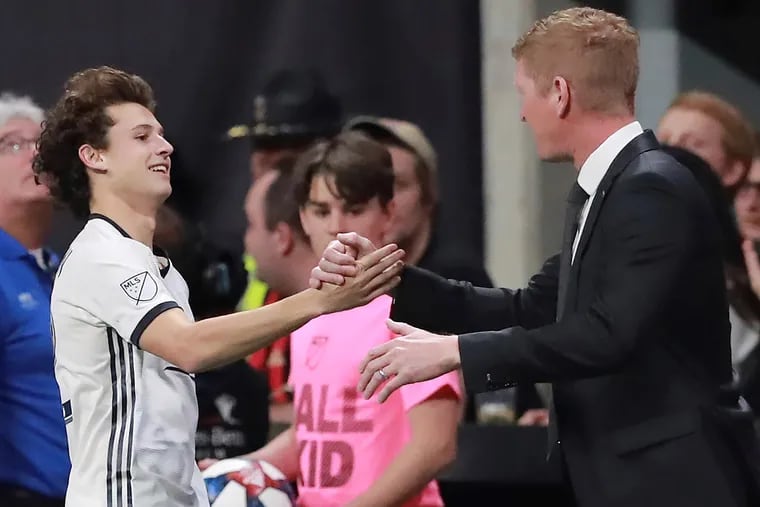 Brendon Aaronson gets congratulations from Philadelphia Union manager Jim Curtin after scoring his first goal in Major League Soccer.
