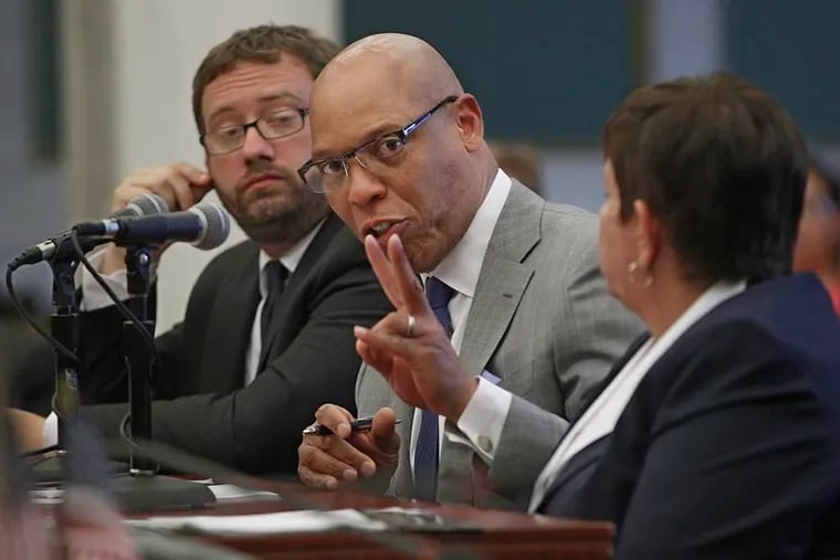 Superintendent William R. Hite, center, seated between Matt Stanksi (L), CFO, and Marge Neff (R), Chairwoman of the SRC, answers a question posed to him by Councilwoman Cindy Bass during the school district's annual pitch for more funding on May 26, 2015. ( Michael Bryant / Staff Photographer )